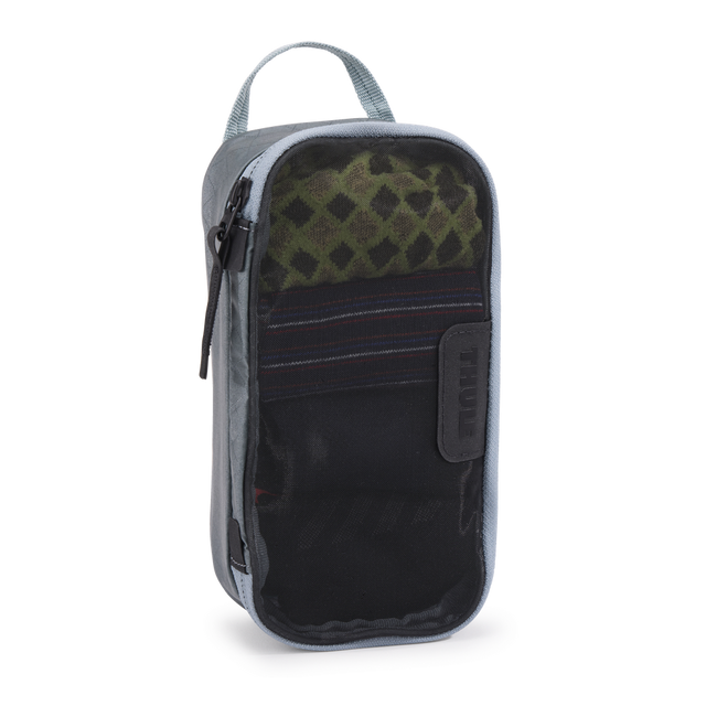 Thule packing cube x-small in Pond Gray, top-down view of the semi-transparent mesh panel