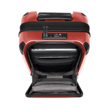 Red hardshell suitcase with an open front compartment and a combination lock.