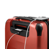 Red suitcase with a built-in USB charging port.