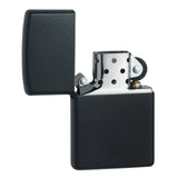 Matte black metal lighter with an open lid revealing the internal mechanism.