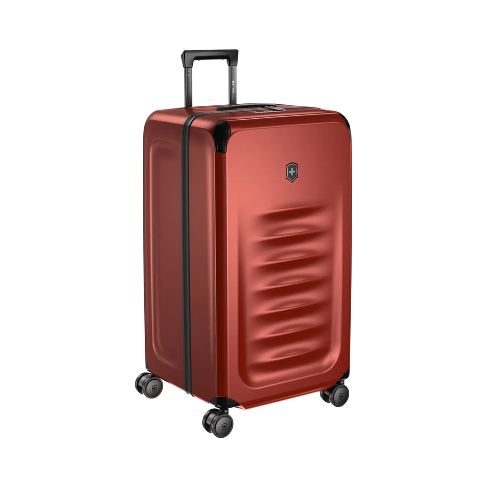 Red hardshell rolling suitcase with a retractable handle and wheels.