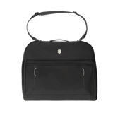 Black handbag with a top handle and front pockets.