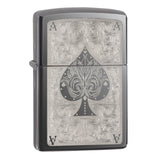 Zippo lighter with an ornate ace of spades design engraved on its surface.