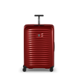 Red hardshell rolling suitcase with horizontal ridges and a retractable handle.