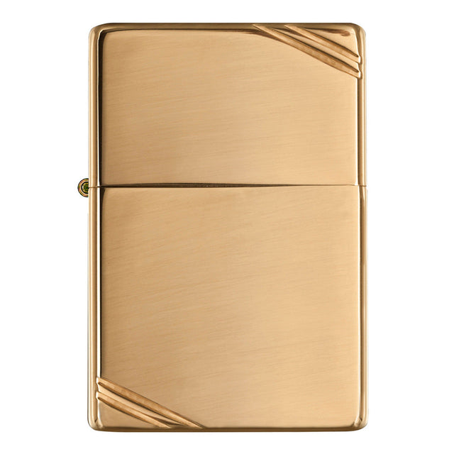 Gold-colored metal lighter with diagonal corner accents.