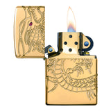 Gold-plated Zippo lighter with an engraved dragon design and a lit flame.