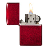 Red metallic lighter with an open flame.