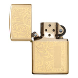 Gold-colored metal lighter with an ornate floral engraved pattern on its surface.
