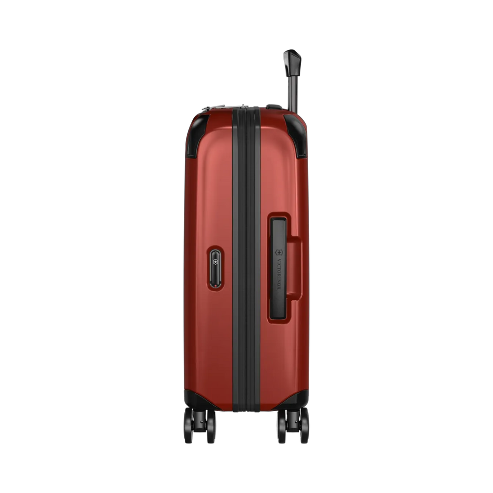 Red hardshell rolling suitcase with black trim and wheels.