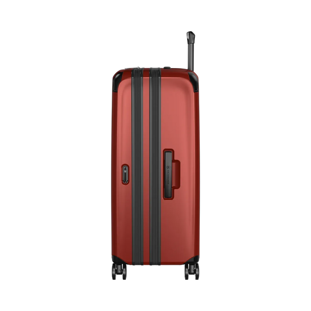 Red hardshell suitcase with black trim and wheels.