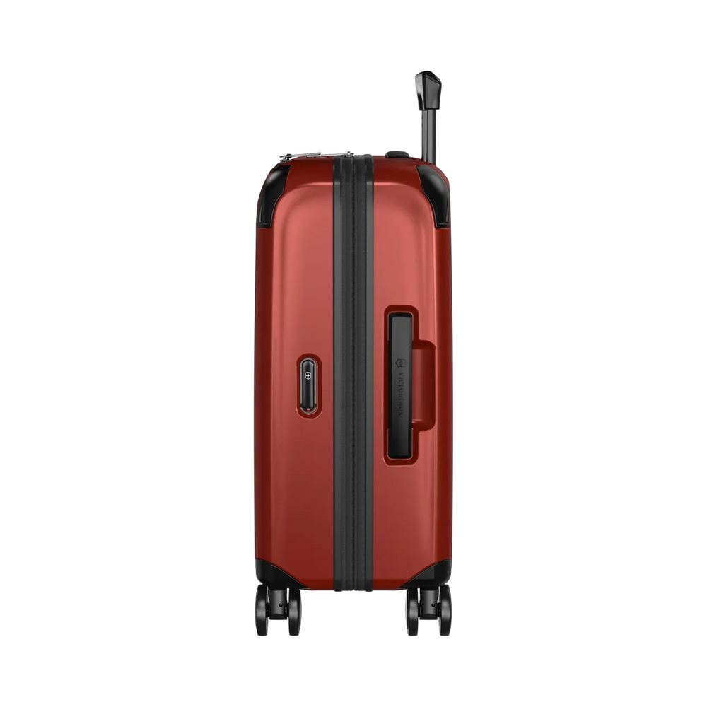 Red hardshell rolling suitcase with black trim and wheels.