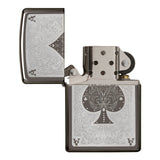 Ornate metal lighter with an engraved spade symbol and decorative patterns.