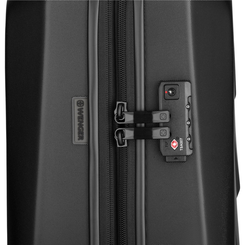 TSA-approved lock on a black hardshell suitcase zipper.