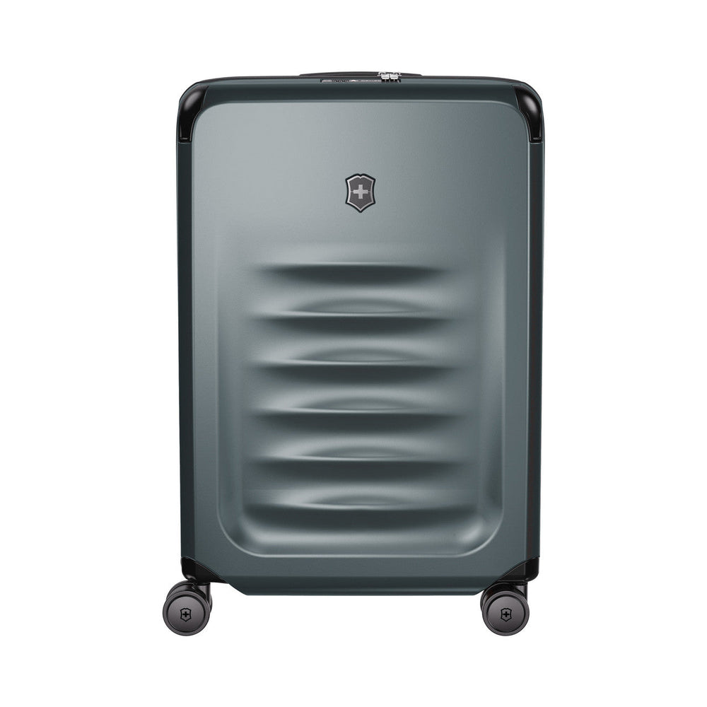 Gray hardshell rolling suitcase with horizontal ridges and a logo emblem.