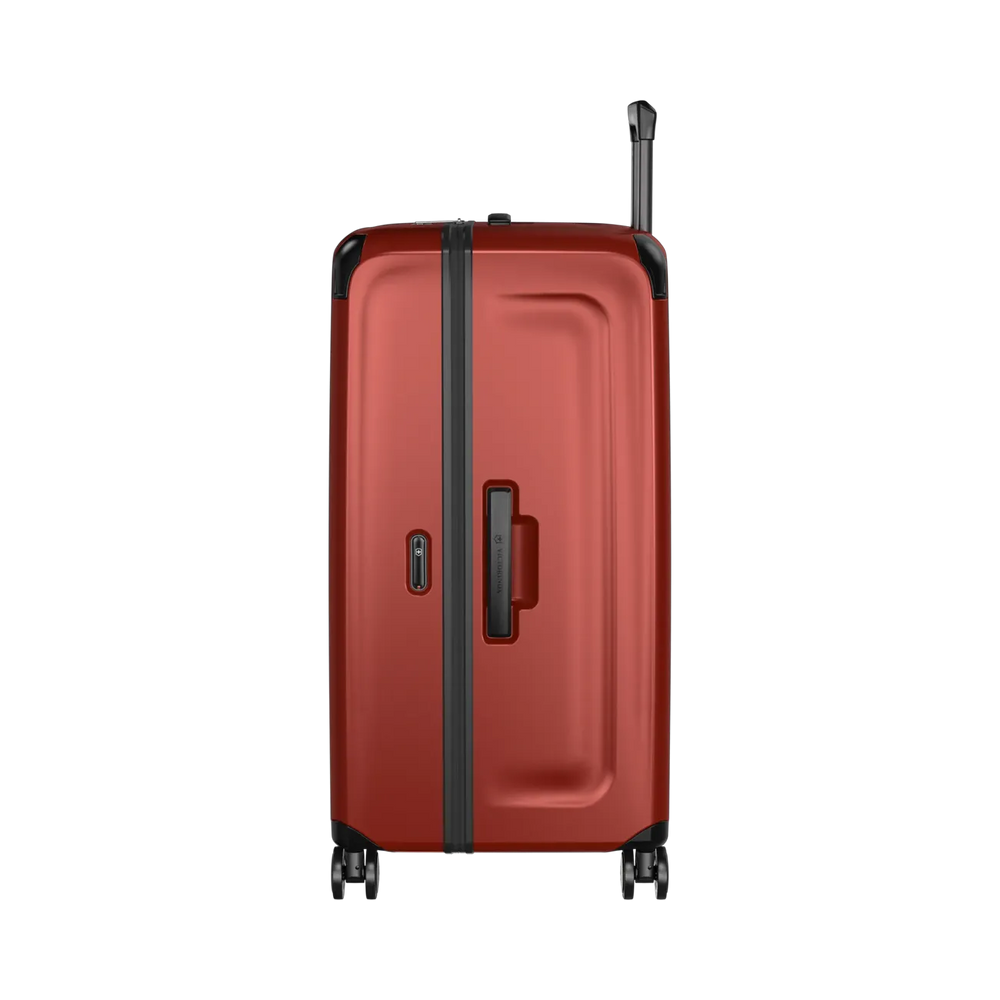 Red hardshell rolling suitcase with black trim and wheels.