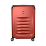 Red hardshell rolling suitcase with horizontal ridges and a logo emblem.