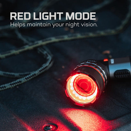 Flashlight with a glowing red LED light in its ’Red Light Mode’.