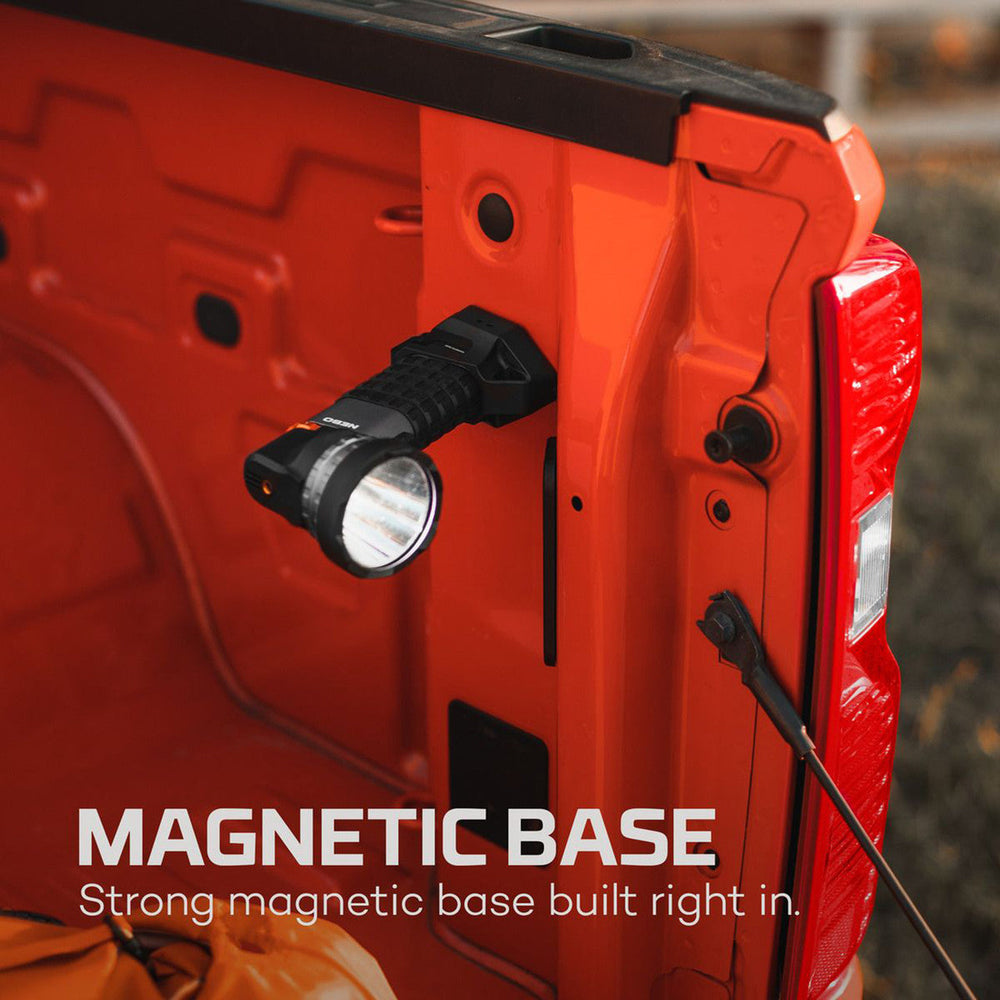 Red power tool or work light with a built-in magnetic base and flashlight attachment.
