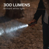 Flashlight emitting a bright beam of light in a dark environment.