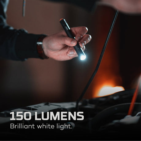 Handheld flashlight emitting a bright beam of light.