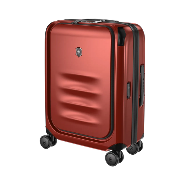 Red hardshell rolling suitcase with horizontal ridges on the front panel.