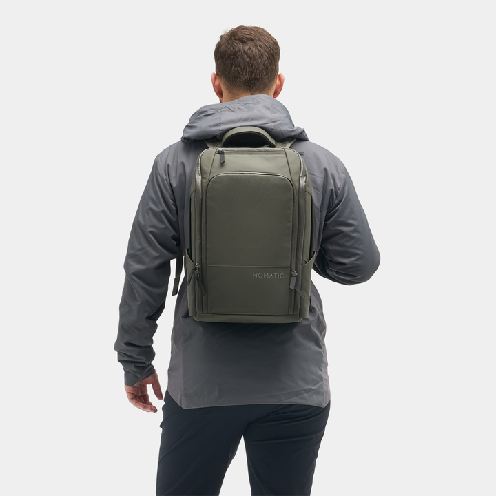 Nomatic Travel Pack 14L in olive on a commute