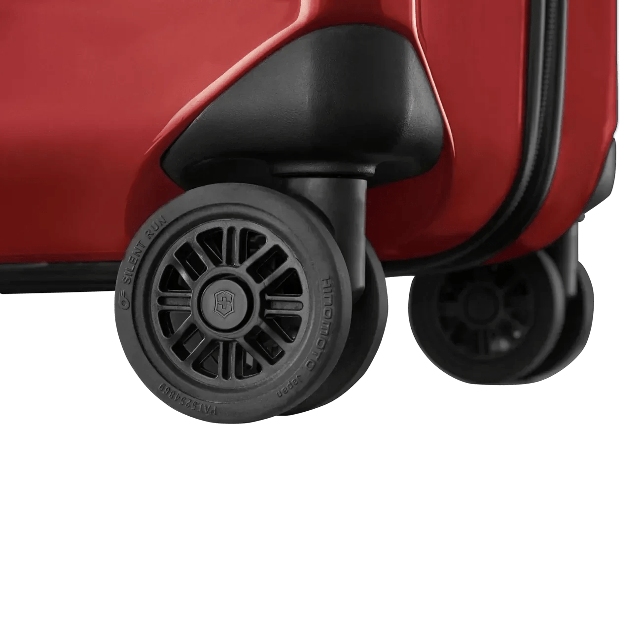 Wheels of a red suitcase or luggage.