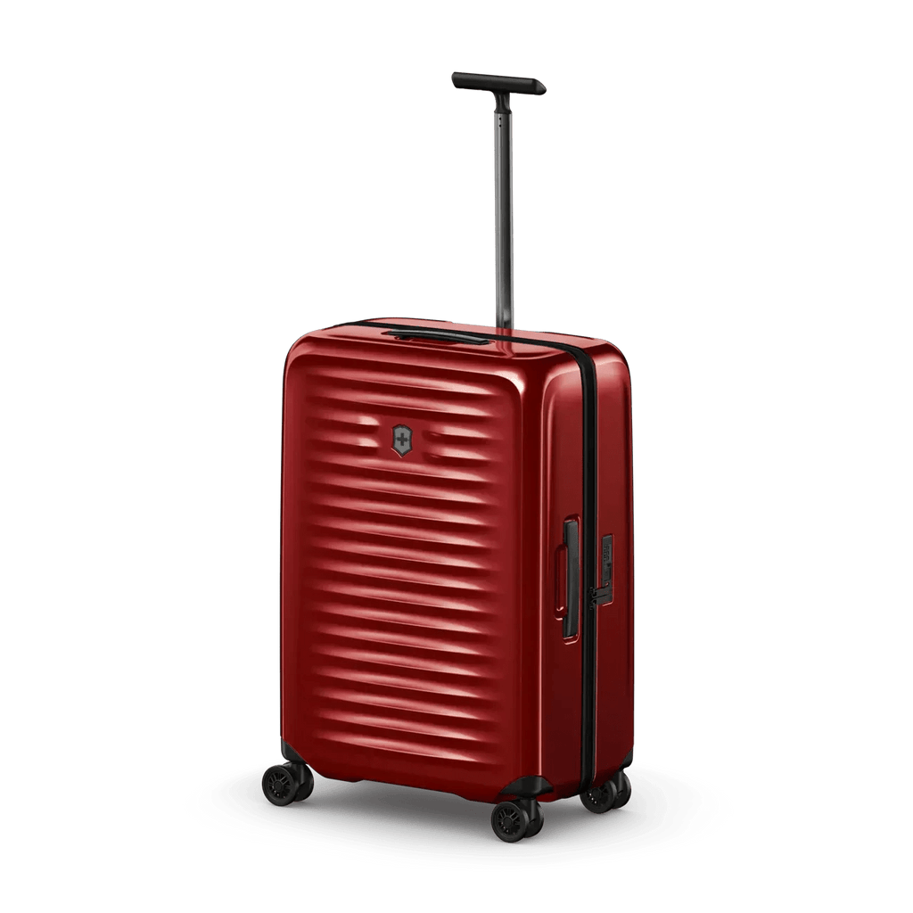 Red hardshell rolling suitcase with horizontal ridges and an extendable handle.