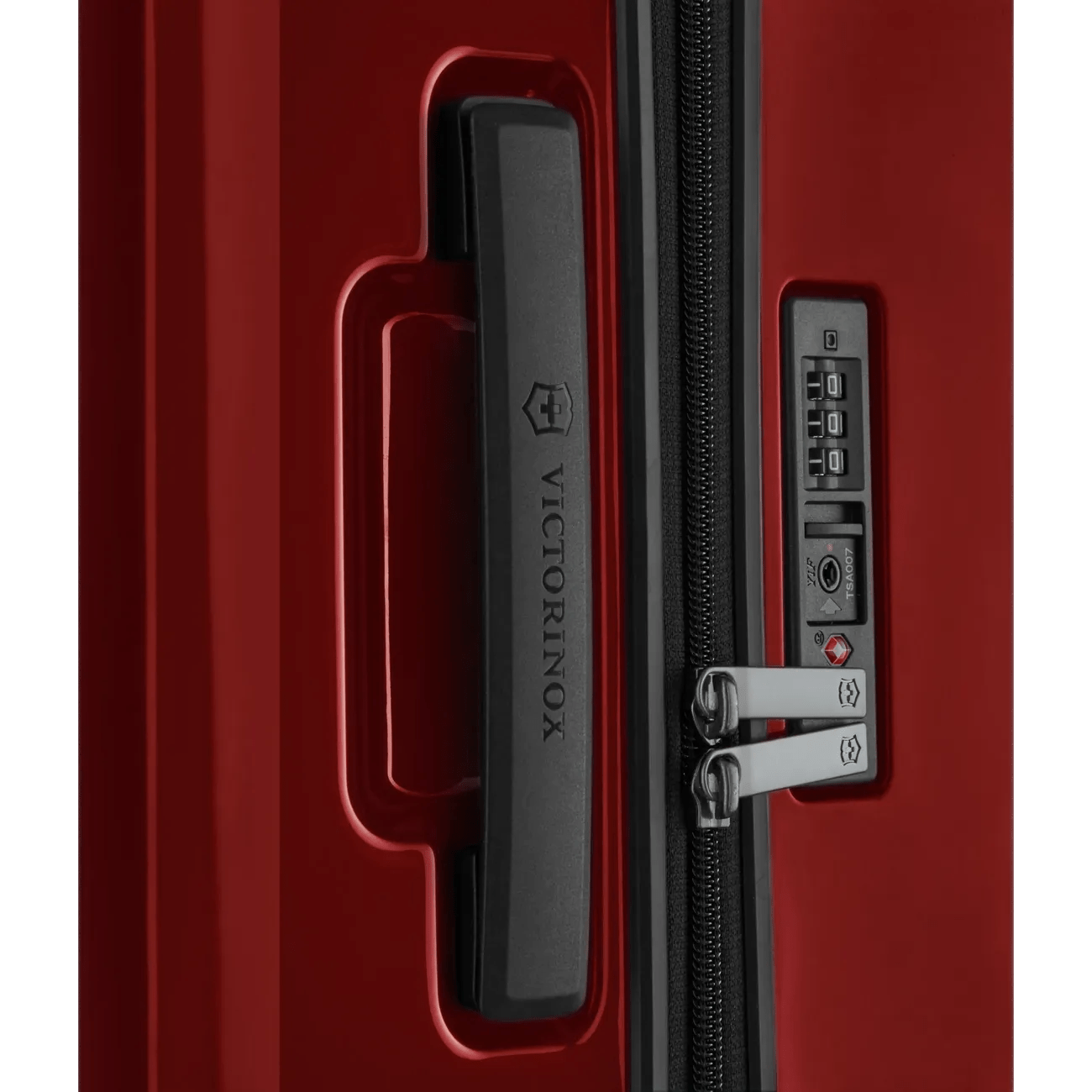 Red hardshell suitcase with a combination lock and zipper.