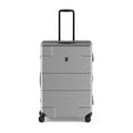 Gray hardshell rolling suitcase with a retractable handle and wheels.