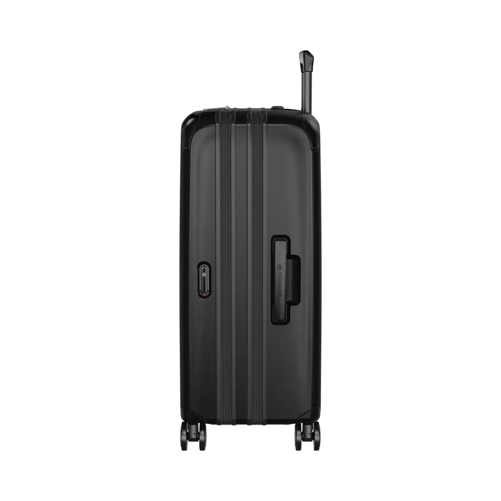 Black hardshell rolling suitcase with vertical ridges and a retractable handle.