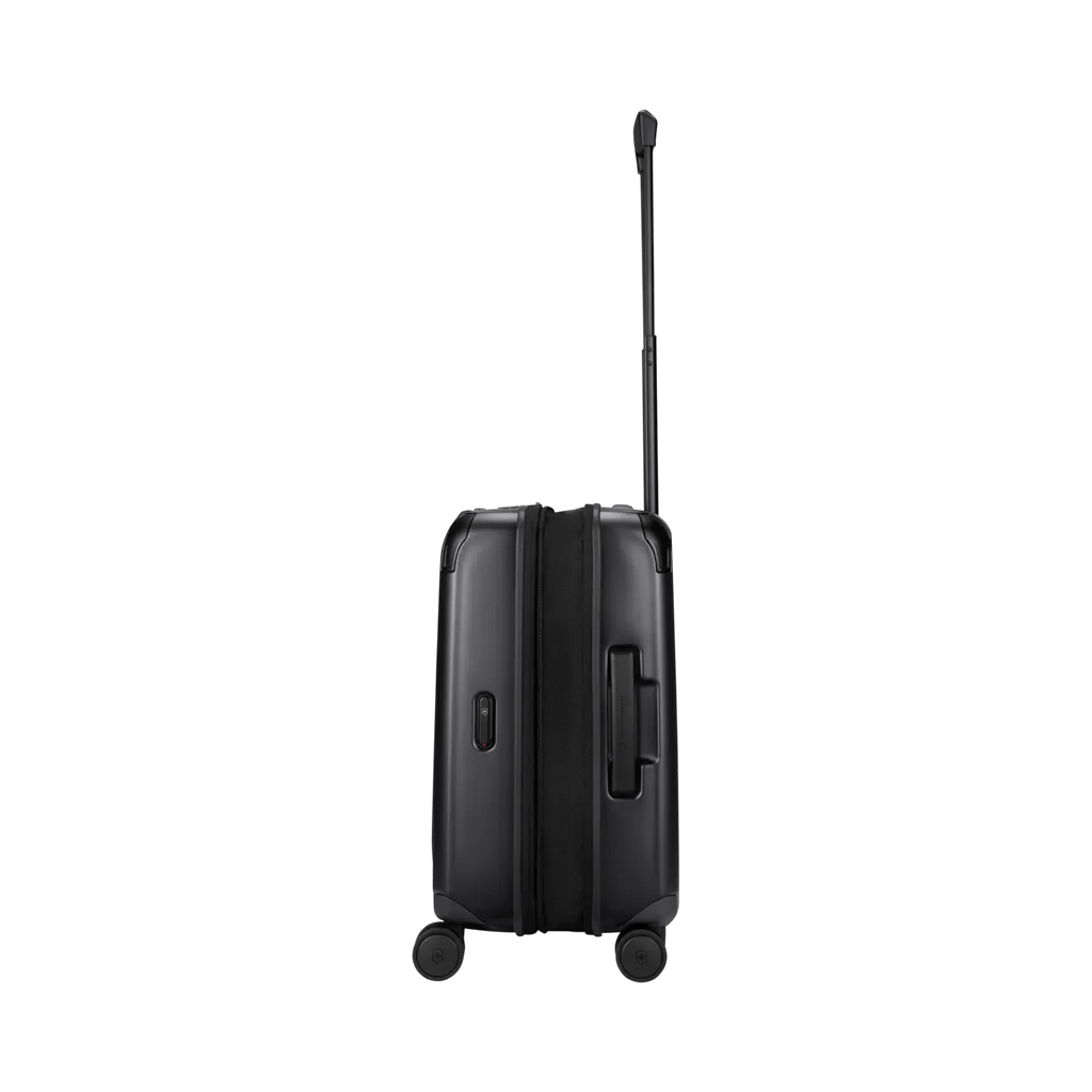 Black hard-shell rolling suitcase with an extendable handle.