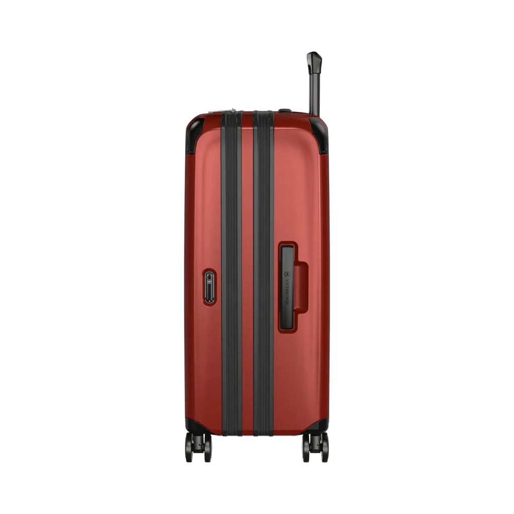 Red hardshell suitcase with black trim and wheels.