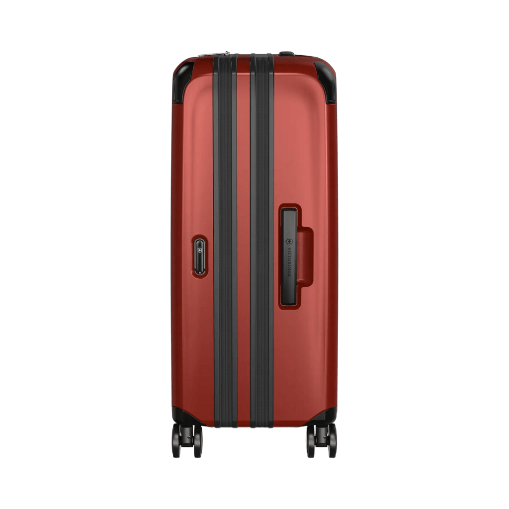 Red hardshell suitcase with black trim and wheels.