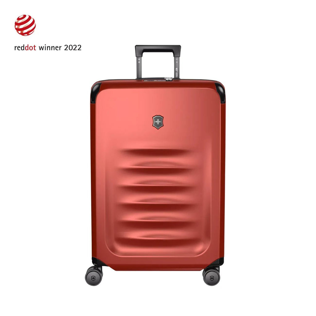 Red hardshell rolling suitcase with horizontal ridges and a retractable handle.