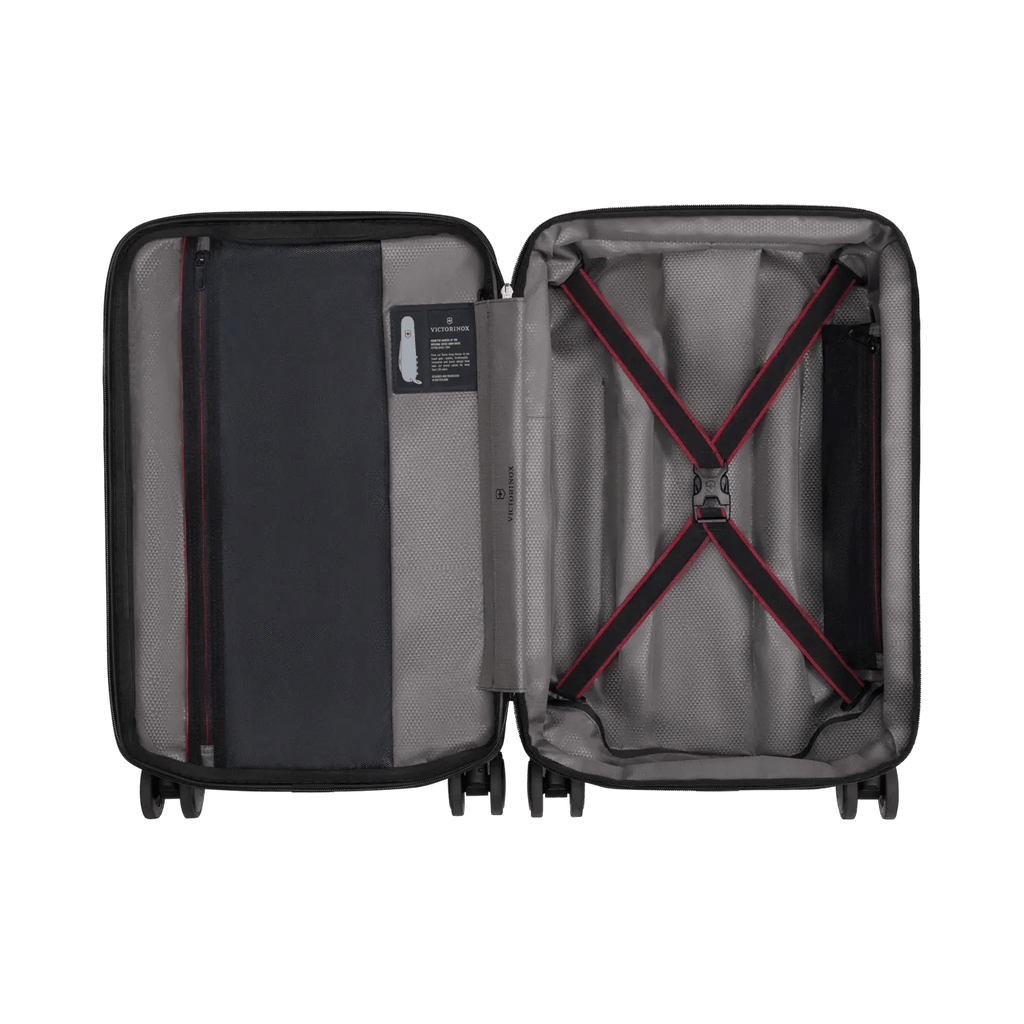 Open suitcase with interior compartments and straps visible.
