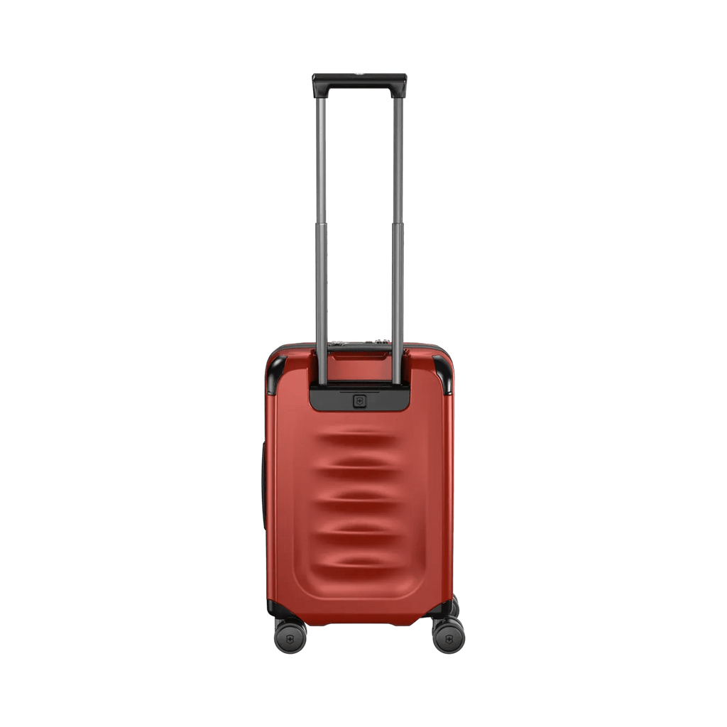 Red hardshell rolling suitcase with an extendable handle and wheels.