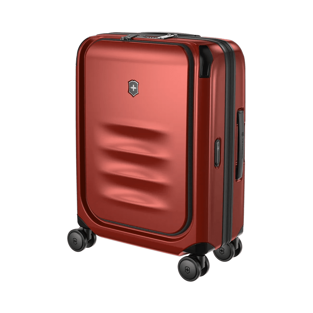 Red hardshell rolling suitcase with horizontal ridges on the front panel.