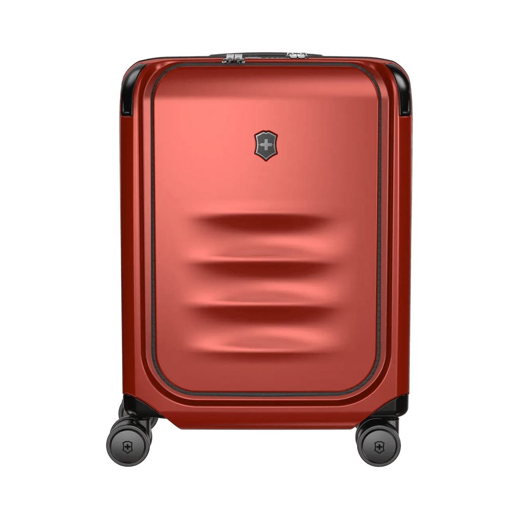 Red hardshell rolling suitcase with horizontal ridges on the front panel.