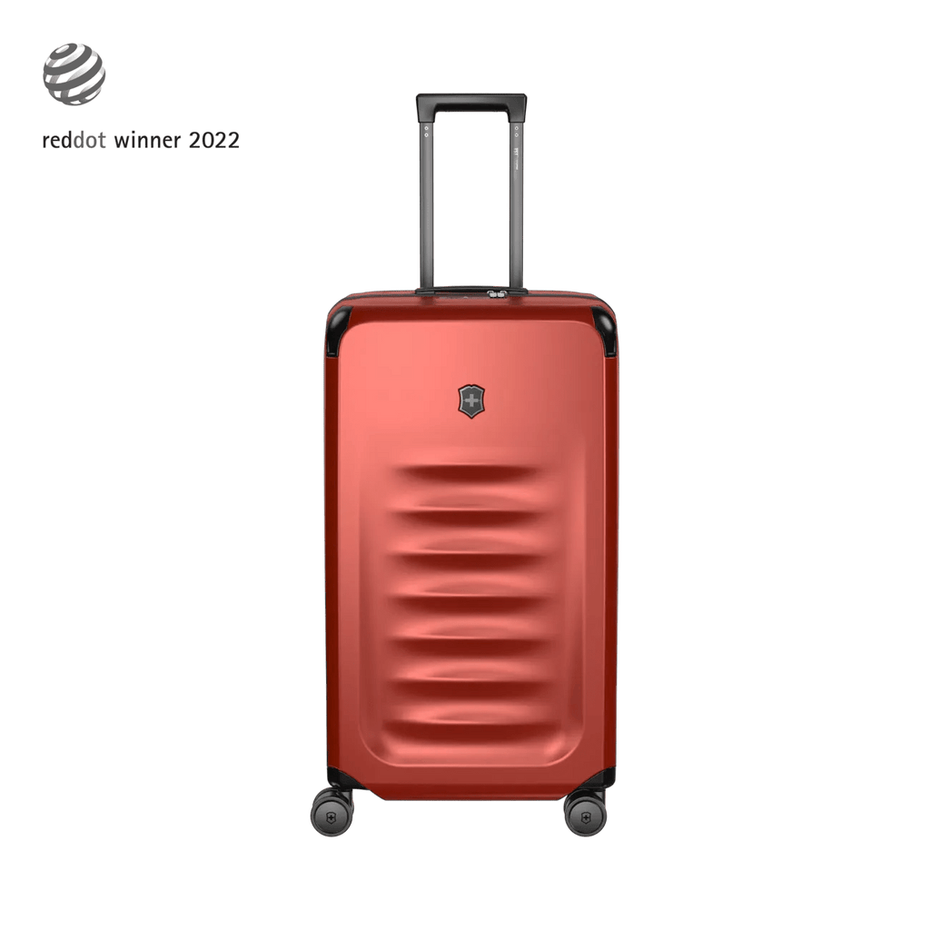 Red hardshell rolling suitcase with horizontal ridges and a retractable handle.